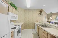 213 Kings Trail # 1004, Sunset Beach, NC 28468 — 2-bedroom condo in Sea Trail Plantation, Sunset Beach, NC, photo 10 of 52: 20_kitchen