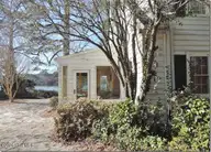 2856a Forest Hills Loop SW, Wilson, NC 27893 — 3-bedroom waterfront home, Wilson, NC, photo 11 of 58: 11 _ Sun Porch _ Stone Patio