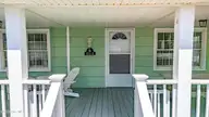 401 E Atlantic Boulevard, Atlantic Beach, NC 28512 — 4-bedroom waterfront home, Atlantic Beach, NC, photo 16 of 61: Entrance front porch view
