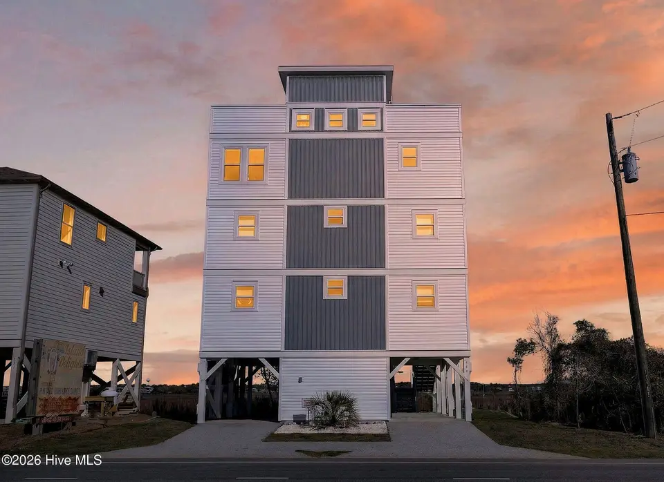 321 N New River Drive, Surf City, NC 28445 — 6-bedroom waterfront home, Surf City, NC, photo 1 of 73: 321NNewRiver_Front_Dusk_02