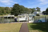 152 Arborvitae Drive, Pine Knoll Shores, NC 28512 — 3-bedroom waterfront home in Pine Knoll Association, Pine Knoll Shores, NC, photo 3 of 61: Boat lift only