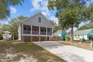 101 SW 28th Street, Oak Island, NC 28465 — 5-bedroom home in Pinners Point, Oak Island, NC, photo 3 of 56: Concrete Drive