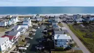 938 Ocean Boulevard W, Holden Beach, NC 28462 — 4-bedroom waterfront home, Holden Beach, NC, photo 5 of 7: drone view