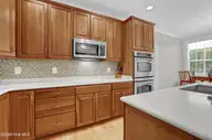 134 Wild Berry Lane, Hampstead, NC 28443 — 5-bedroom waterfront home in Bent Tree, Hampstead, NC, photo 10 of 46: Double Ovens