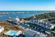 202 Lewis Drive Unit 1207, Carolina Beach, NC 28428 — 3-bedroom waterfront condo in Otter Creek, Carolina Beach, NC, photo 1 of 53: 033-202LewisDrive-1207-CarolinaBeach-NC-