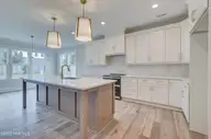 125 Cove Side Lane, Hampstead, NC 28443 — 4-bedroom waterfront home in Pelican Sound, Hampstead, NC, photo 13 of 29: kitchen