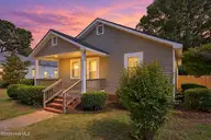3631 S Lynch Street, Fountain, NC 27829 — 2-bedroom home, Fountain, NC, photo 3 of 44: Cozy twilight home with warm lights-3