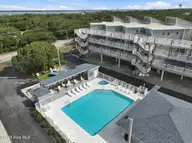 855 Salter Path Road 115, Indian Beach, NC 28512 — 2-bedroom waterfront condo in Colony By The Sea, Indian Beach, NC, photo 18 of 26: Pool aerial view