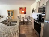330 S Middleton Drive NW Unit 505, Calabash, NC 28467 — 2-bedroom waterfront condo in Brunswick Plantation, Calabash, NC, photo 8 of 72: 505 kitchen to dining