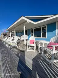 801 Ocean Drive, Emerald Isle, NC 28594 — 4-bedroom waterfront home, Emerald Isle, NC, photo 5 of 32: 5 Pick a seat to enjoy the breeze a