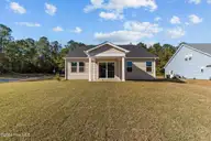 607 Ashvale Lane SE, Bolivia, NC 28422 — 3-bedroom home in Goose Marsh, Bolivia, NC, photo 2 of 22: Lot 216GM - Exterior Back