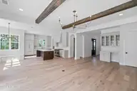 217 Paddle Court, Wilmington, NC 28412 — 3-bedroom home in Riverlights, Wilmington, NC, photo 6 of 25: Oak Hill Living to Kitchen View