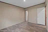 3080 Cross Street SW, Shallotte, NC 28470 — 3-bedroom manufactured home in Shell Point, Shallotte, NC, photo 19 of 35: Guest Bedroom 1