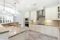 1454 Dunes Boulevard SW, Ocean Isle Beach, NC 28469 — 4-bedroom home in Retreat At OIB, Ocean Isle Beach, NC, photo 12 of 52: Granite countertops