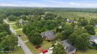 132 42 Quail Woods Drive, New Bern, NC 28560 — lot in Quail Woods Village, Ltd, New Bern, NC, photo 5 of 6: 9-web-or-mls-DJI_20260511130232_0362_D