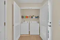 129 NE 13th Street, Oak Island, NC 28465 — 3-bedroom home, Oak Island, NC, photo 20 of 68: Laundry Area