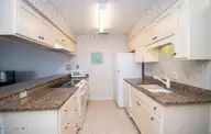 9100 Reed Drive 3202, Emerald Isle, NC 28594 — 1-bedroom waterfront condo in Queens Court, Emerald Isle, NC, photo 6 of 52: Granite countertops