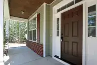 39 Forest Lake Drive, Jackson Springs, NC 27281 — 4-bedroom home in Foxfire Village East, Jackson Springs, NC, photo 8 of 49: 8 Front Shady Rocking Chair Porch