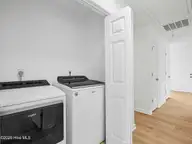 625 S Hampton Drive, Jacksonville, NC 28546 — 3-bedroom home in Cottage Cove, Jacksonville, NC, photo 24 of 50: Laundry Closet in Hallway
