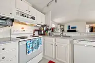 1530 Salter Path Road 15, Indian Beach, NC 28512 — 2-bedroom waterfront manufactured home in Tradewinds, Indian Beach, NC, photo 7 of 32: Kitchen