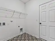 38 N District Avenue, Clayton, NC 27527 — 3-bedroom home in Flowers Plantation, Clayton, NC, photo 19 of 38: 018-1280x960-laundry