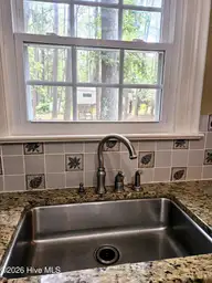 715 Evergreen Road, Rocky Mount, NC 27803 — 4-bedroom home in West Haven, Rocky Mount, NC, photo 15 of 42: Evergreen Kitchen Sink with View of Back