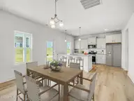 501 Bartley Street, Vass, NC 28394 — 3-bedroom home in Badgers Court, Vass, NC, photo 23 of 28: Builder Rep photo- Grenoble dinng room