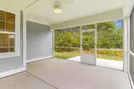 222 Windswept Lane, Beaufort, NC 28516 — 4-bedroom home in Beaufort Club, Beaufort, NC, photo 10 of 53: Screened in Porch with Nature Views
