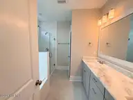 132 Flat Clam Drive, Wilmington, NC 28401 — 4-bedroom home in Riverside Cove, Wilmington, NC, photo 16 of 28: Owners Bath