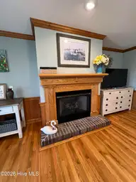 105 Franklin Court, Cedar Point, NC 28584 — 3-bedroom waterfront home in Cedar Point Beach, Cedar Point, NC, photo 17 of 53: 14a Fireplace with custom woodwork