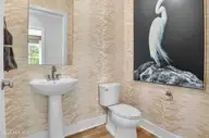 258 Sand Dollar Lane, Southport, NC 28461 — 4-bedroom home in Waters at Southport, Southport, NC, photo 6 of 55: Powder Room