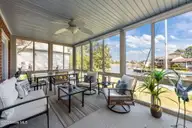 904 Coral Court, New Bern, NC 28560 — 4-bedroom waterfront home in Fairfield Harbour, New Bern, NC, photo 4 of 64: Sunroom