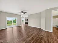 501 Millbrooke Circle, Elizabeth City, NC 27909 — 4-bedroom home in Millbrooke, Elizabeth City, NC, photo 21 of 37: Living Room To Dining/Kitchen