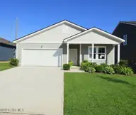 208 Ocean Pointe Boulevard SE 5301, Bolivia, NC 28422 — 4-bedroom home in Ocean Pointe, Bolivia, NC, photo 2 of 17: front- AI Generated