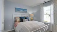 2011 Snipe Lane, Shallotte, NC 28470 — 3-bedroom home in The Meadows at Wildwood Village, Shallotte, NC, photo 20 of 25: Secondary Bedroom