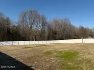 511 Heron Drive, Goldsboro, NC 27534 — 3-bedroom home in Heron Creek, Goldsboro, NC, photo 15 of 34: back yard from L corner