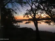 112 Coastal Bluffs Court, Hampstead, NC 28443 — 4-bedroom waterfront home in Olde Point, Hampstead, NC, photo 5 of 37: Sunrise at the Bluffs