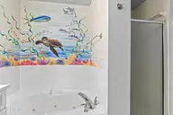 2555 St James Drive SE Unit 101, Southport, NC 28461 — 3-bedroom condo in St James, Southport, NC, photo 22 of 53: Primary Bath