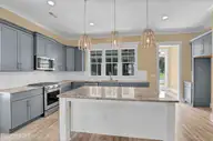 110 Whispering Pine Lane, Holly Ridge, NC 28445 — 4-bedroom waterfront home in Summerhouse On Everett Bay, Holly Ridge, NC, photo 9 of 28: Kitchen Island