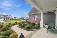 210 Knots Bend Drive, Hampstead, NC 28443 — 4-bedroom home in Salters Haven at Lea Marina, Hampstead, NC, photo 9 of 72: 11_front right porch