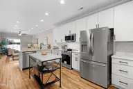 235 Cline Way Unit 107, Beaufort, NC 28516 — 3-bedroom townhome in 1809 Live Oak, Beaufort, NC, photo 4 of 38: Open Concept Kitchen Living Dining Area