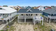 461 E Third Street, Ocean Isle Beach, NC 28469 — 4-bedroom waterfront home, Ocean Isle Beach, NC, photo 2 of 57: Front