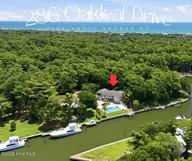 286 Oakleaf Drive, Pine Knoll Shores, NC 28512 — 3-bedroom waterfront home in Pine Knoll Association, Pine Knoll Shores, NC, photo 1 of 61: Pic