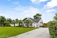 4809 W Grove Drive, Wilmington, NC 28409 — 4-bedroom home in Masonboro Woods, Wilmington, NC, photo 3 of 40: Front Exterior (5)