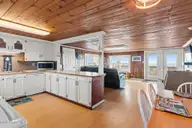 4025 E Beach Drive, Oak Island, NC 28465 — 3-bedroom waterfront home in Long Beach, Oak Island, NC, photo 16 of 40: 32-web-or-mls-CAMMediaLLC.com (32 of 47)