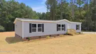 9757 Fire Tower Farm Road, Whitakers, NC 27891 — 3-bedroom manufactured home in Swift Creek Fire Tower, Whitakers, NC, photo 3 of 48: 4-web-or-mls-DJI_20260820131928_0541_D