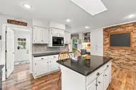 8 N Shamrock Drive, Jackson Springs, NC 27281 — 3-bedroom home in Foxfire Village East, Jackson Springs, NC, photo 20 of 49: Laundry off Kitchen