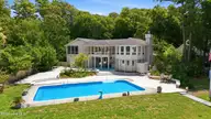 286 Oakleaf Drive, Pine Knoll Shores, NC 28512 — 3-bedroom waterfront home in Pine Knoll Association, Pine Knoll Shores, NC, photo 5 of 61: 56-print-DJI_20260731131405_0214_D