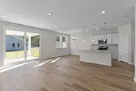 607 Ashvale Lane SE, Bolivia, NC 28422 — 3-bedroom home in Goose Marsh, Bolivia, NC, photo 13 of 22: Lot 216GM - Living-Dining-Kitchen