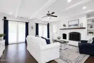 2604 One Iron Street, Morehead City, NC 28557 — 4-bedroom home in Country Club East, Morehead City, NC, photo 11 of 40: Staged family room